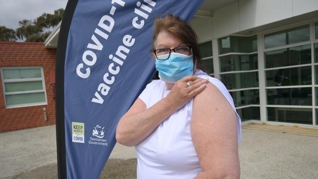 JABBED: Karen Henderson rolls up her sleeves for her first Covid vaccine. Picture: Kenji Sato