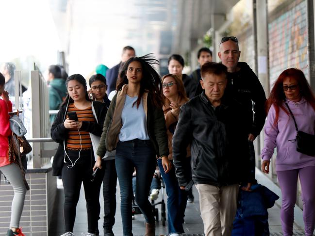 PARRAMATTA ADVERTISER/AAP.  People head to the Auburn railway station in Auburn. Auburn, Thursday 29 August, 2019. Cumberland Council recently discussed heights and densities for Auburn town centre. (AAP IMAGE / Angelo Velardo)