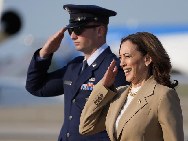 US Vice President and Democratic presidential candidate Kamala Harris salutes as she returns to Joint Base Andrews in Maryland after attending a campaign fundraising event in Massachusetts on July 27, 2024. (Photo by Stephanie Scarbrough / POOL / AFP)