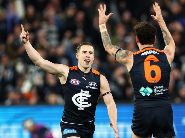 MELBOURNE, AUSTRALIA - JUNE 21: Matthew Owies of the Blues celebrates kicking a goal with Zac Williams of the Blues during the round 15 AFL match between Carlton Blues and Geelong Cats at Melbourne Cricket Ground, on June 21, 2024, in Melbourne, Australia. (Photo by Quinn Rooney/Getty Images)