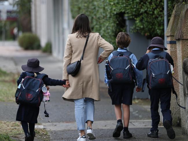Parents arrive at the St Charles catholic school Waverley to remove children after one tested positive to COVID today .picture John Grainger