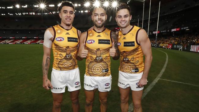 MELBOURNE, AUSTRALIA – MAY 27: Hawthorn Indigenous players Tyler Brockman, Jarman Impey and Karl Amon of the Hawks poses for a photo after the round 11 AFL match between St Kilda Saints and Hawthorn Hawks at Marvel Stadium, on May 27, 2023, in Melbourne, Australia. (Photo by Darrian Traynor/Getty Images)