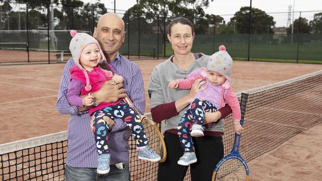 Lynton and Cara Joseph with their 18 month old twins Heidi and Monique. Picture: Ellen Smith