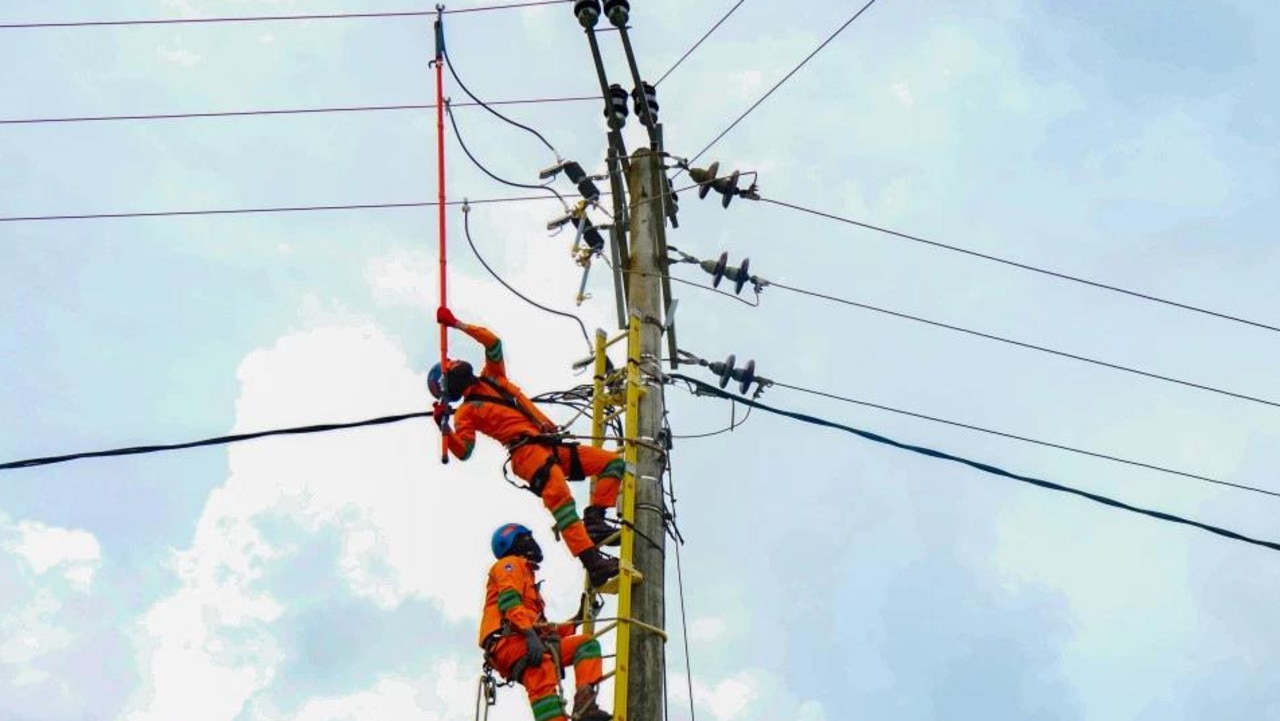 Maintenance work on an electricity pylon in Indonesia. Picture: Adry Denisah