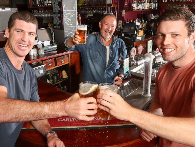 Carlton DraughtÃs 'The Melbourne Shout'' with Jonathan Brown and Ollie Lane having a beer poured by publican Bob OÃKane [centre] at the All Nations Hotel in Richmond. In support of LetÃs Melbourne Again, Carlton Draught is launching The Melbourne Shout, a one-day offer on Saturday November 14 whereby participating pubs across Melbourne will be offering punters 2-for-1 Carlton Draught beers.Picture: Alex Coppel.