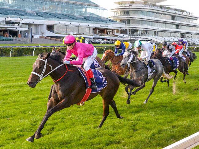 Craig Williams rides favourite Betcha Flying to victory on Anzac Day.