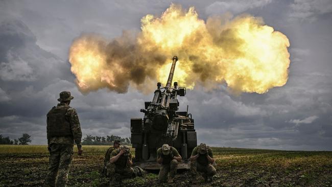 Ukrainian servicemen fire with a French self-propelled 155 mm/52-calibre gun Caesar towards Russian positions at a front line in the eastern Ukrainian region of Donbas. Picture: AFP