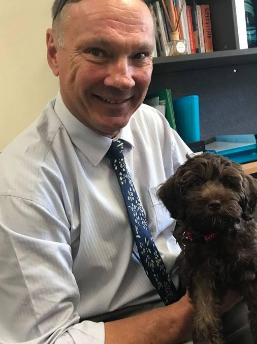 School Principal Scot Steinhardt with Maple, the school newest student support companion. 