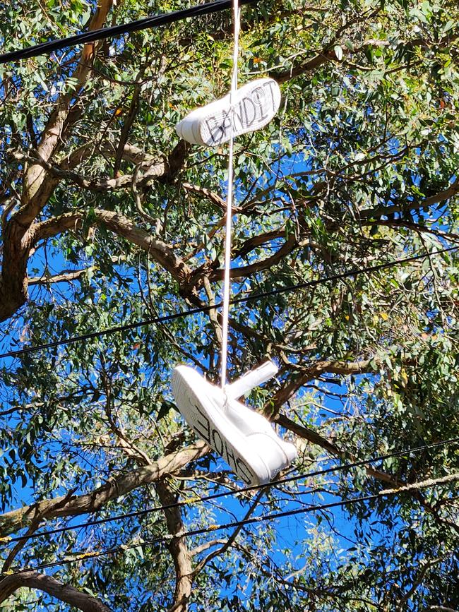 Shoes have been tied together and thrown across power lines over various streets in Bridgewater and Aldgate, in the Adelaide Hills. Picture: Lynton Grace