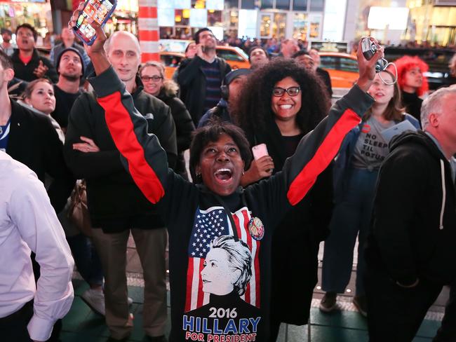 A Hillary Clinton supporter reacts after she was projected to win the state of California in Times Square on November 8, 2016 in New York City. Trump was leading the delegate count and popular vote late election night. Michael Reaves/Getty Images/AFP == FOR NEWSPAPERS, INTERNET, TELCOS & TELEVISION USE ONLY ==