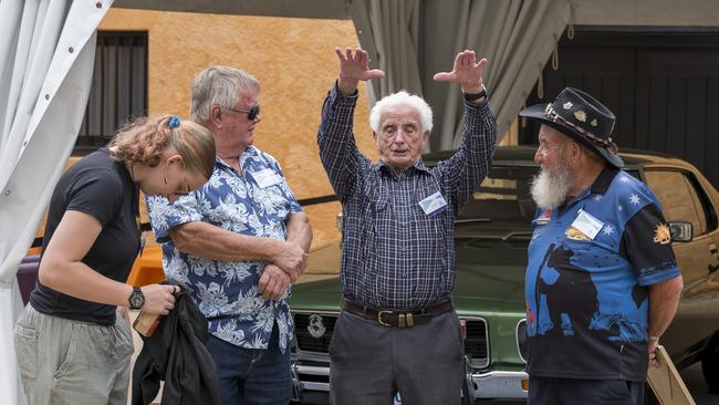 Sally Boxhall (granddaughter to Lawrence), Lawrence Boxhall (left) and David Archer (right) chatting to Frank Manley (centre). Picture: Caroline Tan