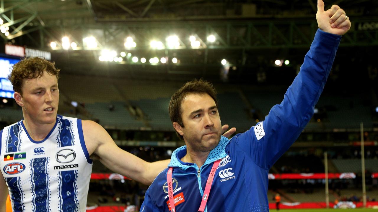 An emotional Brad Scott gives North Melbourne supporters a thumbs up after the club’s win over Western Bulldogs. Picture: AAP Image/Hamish Blair.