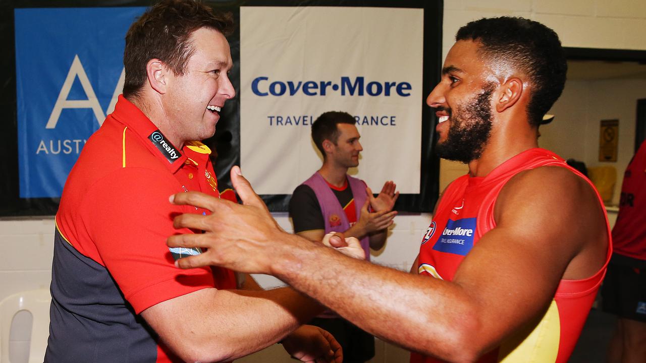 MELBOURNE, AUSTRALIA - APRIL 07: Suns head coach Stuart Dew celebrates the win with Touk Miller of the Suns during the round three AFL match between the Western Bulldogs and the Gold Coast Suns at Marvel Stadium on April 07, 2019 in Melbourne, Australia. (Photo by Michael Dodge/Getty Images)