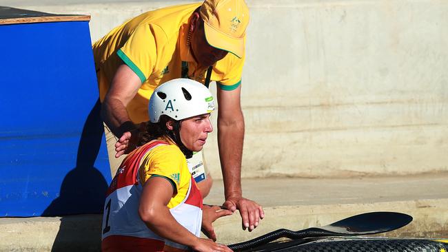 Jessica Fox is consoled by father Richard after being penalised two seconds by the video judge. Picture. Phil Hillyard