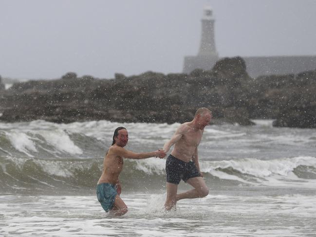 Hardy swimmers brave the snowy conditions at King Edwards bay near Tynemouth, England, following heavy overnight snowfall which has caused disruption across Britain, early Tuesday Feb. 27, 2018. Many areas of the UK have seen a blanketing of snow, with police forces reporting treacherous driving conditions as temperatures have plummeted. Picture: AP