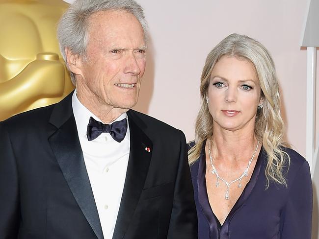 HOLLYWOOD, CA - FEBRUARY 22:  Director Clint Eastwood (L) and Christina Sandera attend the 87th Annual Academy Awards at Hollywood & Highland Center on February 22, 2015 in Hollywood, California.  (Photo by Jason Merritt/Getty Images)