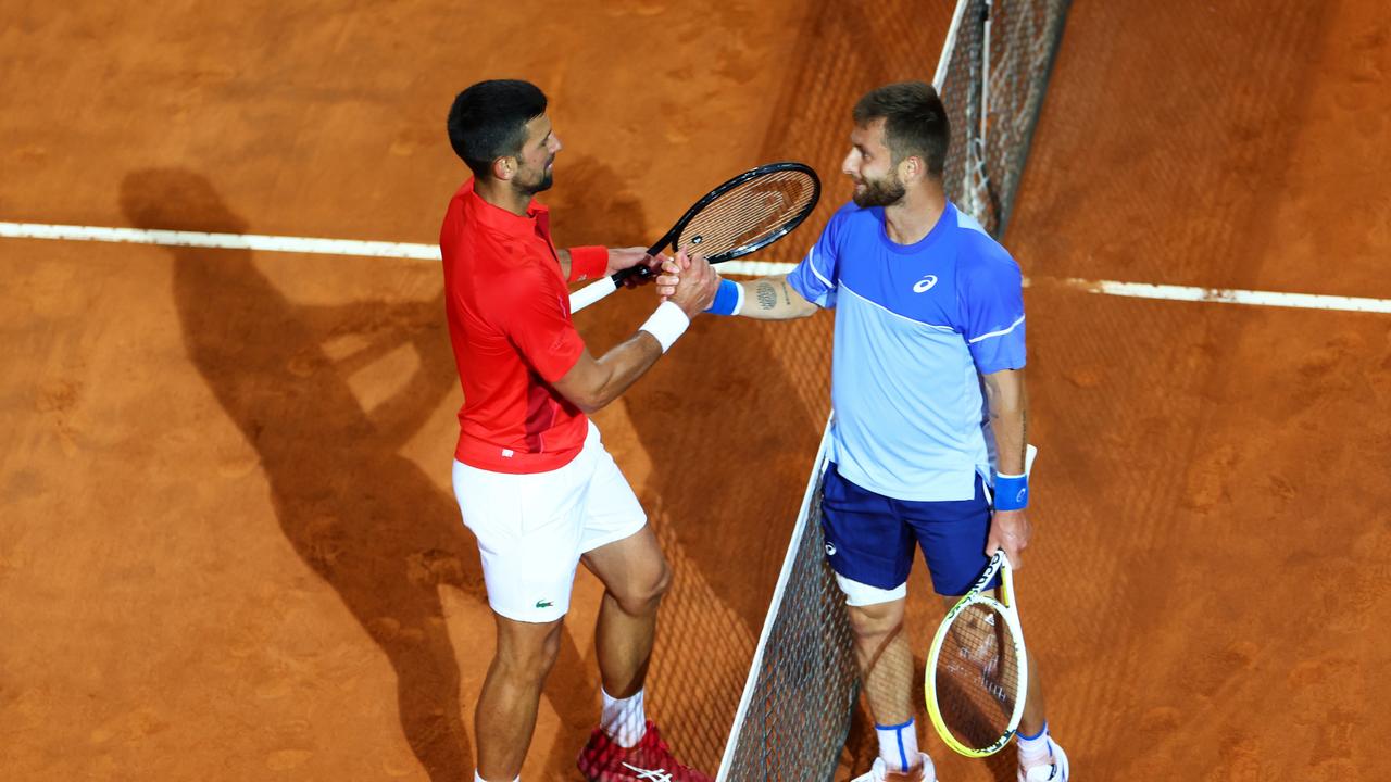 Novak Djokovic shakes hands with Corentin Moutet. (Photo by Dan Istitene/Getty Images)