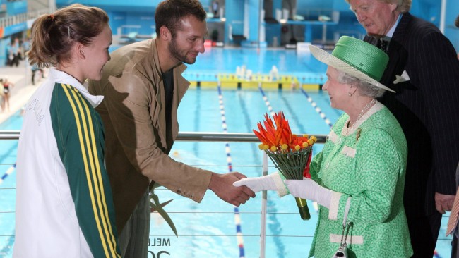 The Queen, standing next to Ron Walker, meets Ian Thorpe and Kylie Palmer on Day 1 of the 2006 Commonwealth Games in Melbourne. Picture: Nathan Richter/News Corp Australia