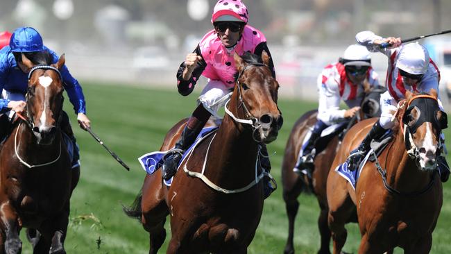 Jockey Hugh Bowman celebrates after winning the Coolmore Stud Stakes with Flying Artie. Picture: AAP