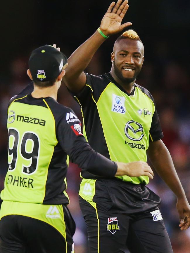 Russell enjoys a high five during his last BBL stint.