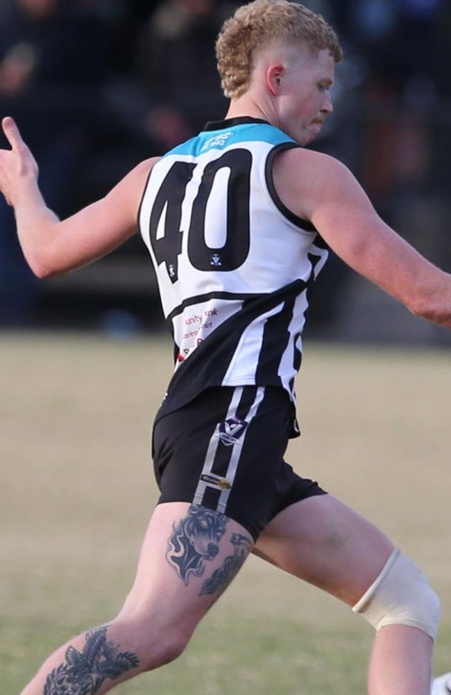 Liam Tyrrell takes a kick for Crib Point. Picture: Doug Farr