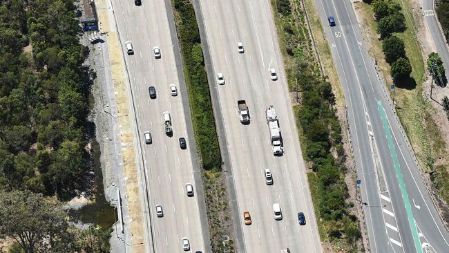 The truck and car crashed on the northbound lanes of the M1 at Oxenford. Picture: Nigel Hallett