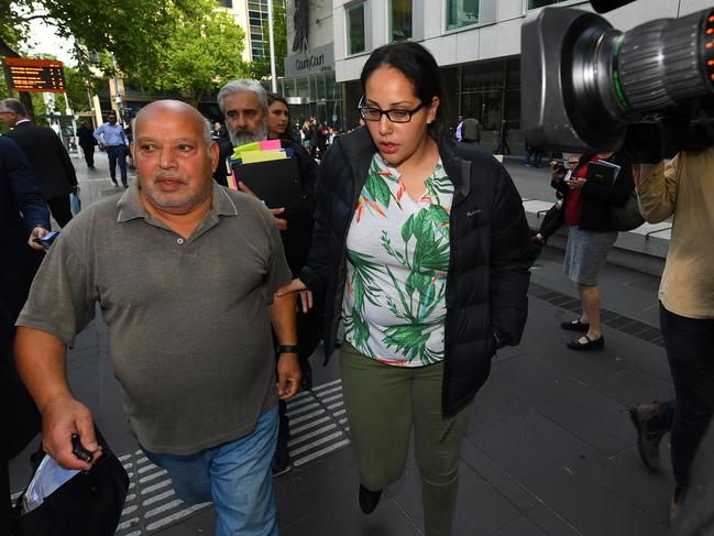 Lydia Abdelmalek (centre) departs the County Court of Victoria in Melbourne. AAP Image