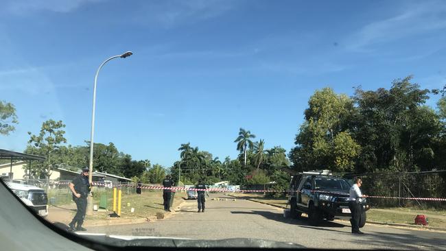 Police at the scene of the alleged murder of a 15-year-old boy at the Bagot Aboriginal community on Tuesday.