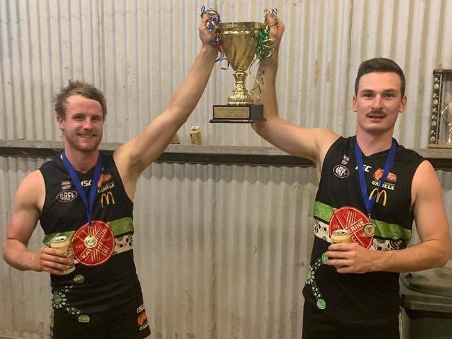 Katherine Camels star Joshua Carlin, right, pictured celebrating his team's Big Rivers Football League premiership triumph last year. Picture: FACEBOOK