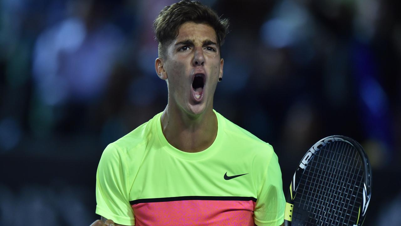 Australia's Thanasi Kokkinakis reacts as he plays against Latvia's Ernests Gulbis during their men's singles match on day one of the 2015 Australian Open tennis tournament in Melbourne on January 19, 2015. AFP PHOTO / PAUL CROCK -- IMAGE RESTRICTED TO EDITORIAL USE - STRICTLY NO COMMERCIAL USE
