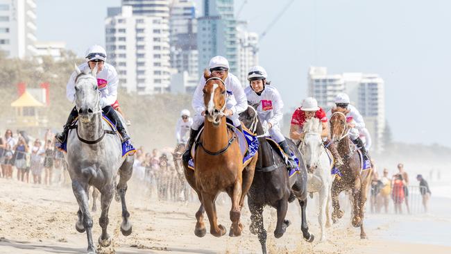 Action from the Magic Millions barrier draw beach run. Picture by Luke Marsden.