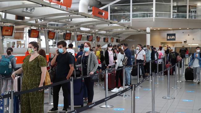 A busy Sydney Airport as travellers looked to flee the city. Picture: David Swift