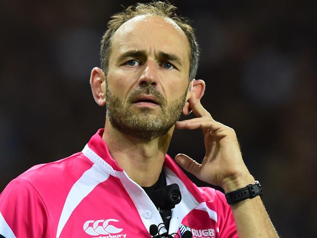 French referee Romain Poite listens to his earpiece during a Pool D match of the 2015 Rugby World Cup between New Zealand and Namibia at the Olympic stadium, east London, on September 24, 2015. AFP PHOTO / GABRIEL BOUYS RESTRICTED TO EDITORIAL USE, NO USE IN LIVE MATCH TRACKING SERVICES, TO BE USED AS NON-SEQUENTIAL STILLS