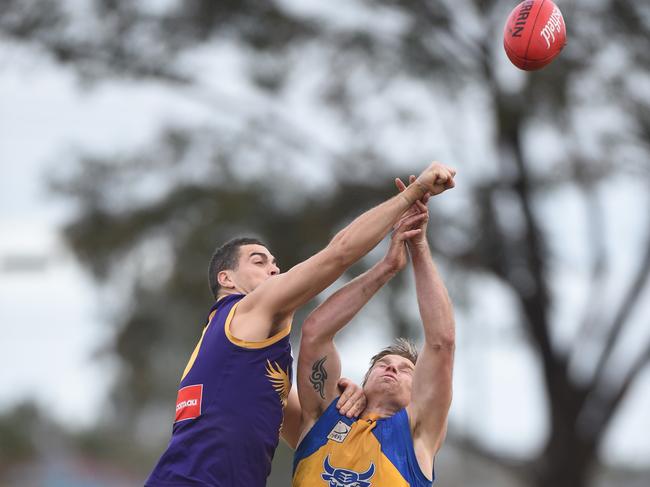 Joel Perry makes a spoil against Noble Park. Picture: Chris Eastman