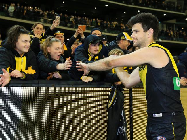 Trent Cotchin celebrates with fans after the win. Picture: Mark Stewart