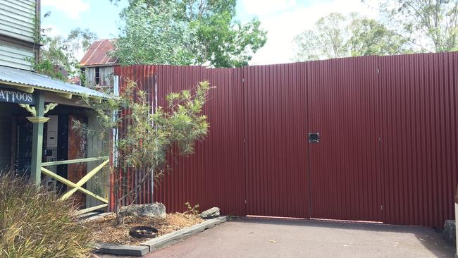Dreamworld’s Thunder River Rapids ride is blocked off by a steel wall.