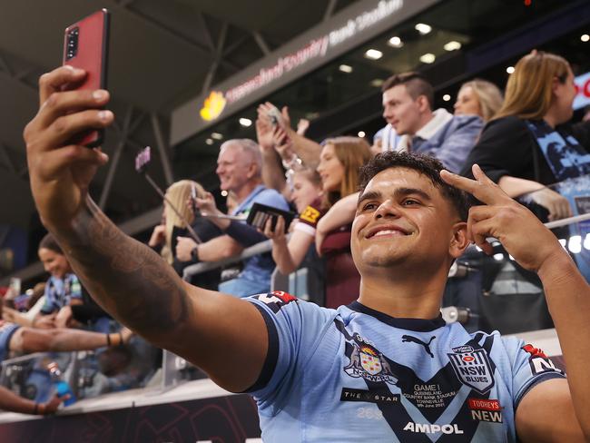 TOWNSVILLE, AUSTRALIA - JUNE 09:  Latrell Mitchell of the Blues poses with fans after winning game one of the 2021 State of Origin series between the New South Wales Blues and the Queensland Maroons at Queensland Country Bank Stadium on June 09, 2021 in Townsville, Australia. (Photo by Mark Kolbe/Getty Images)