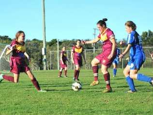 Urunga try desperately to maintain ball control but it was Woolgoolga who came out on top eventually. Picture: Emily Burley