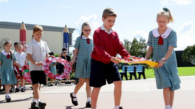 John Palmer School students laying wreaths at the Anzac Day service. Pictures: Peter Kelly