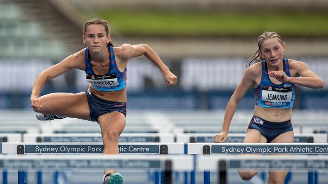 Tammin Lampret in action in the hurdles.