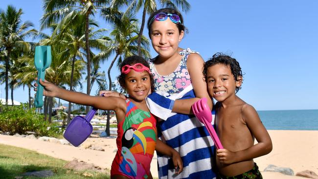 Leilani, 4, Celcelia, 9, and Zeo Billy try and cool off on the Strand. Picture: Evan Morgan