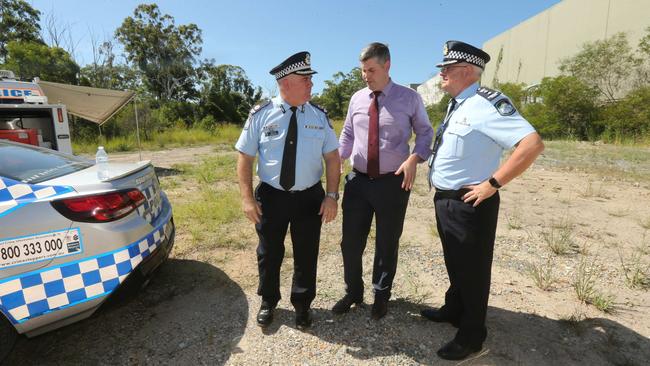 Police Minister Mark Ryan with Assistant Commissioner Brian Codd and former chief superintendent Marty Mickelson (on right) during a tour of a block of land in Arundel earlier this year. Picture Mike Batterham