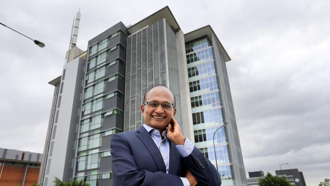 Maha Sinnathamby in front of a building at 145 Sinnathamby Boulevard, Springfield Central, that he bought for $17M.