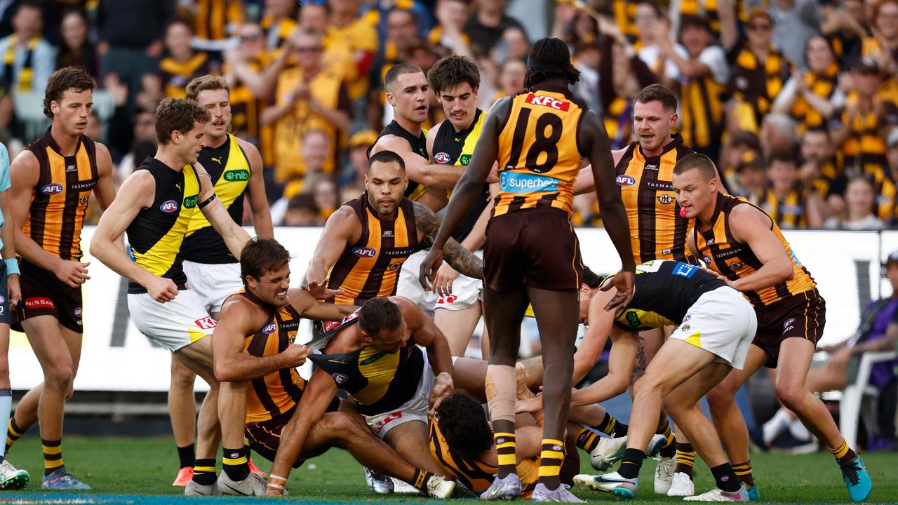 MELBOURNE, AUSTRALIA - MAY 04: Players wrestle during the 2025 AFL Round 08 match between the Hawthorn Hawks and the Richmond Tigers at the Melbourne Cricket Ground on May 4, 2025 in Melbourne, Australia. (Photo by Michael Willson/AFL Photos via Getty Images)