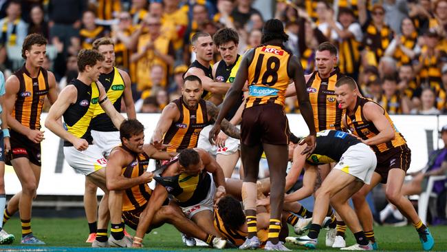 MELBOURNE, AUSTRALIA - MAY 04: Players wrestle during the 2025 AFL Round 08 match between the Hawthorn Hawks and the Richmond Tigers at the Melbourne Cricket Ground on May 4, 2025 in Melbourne, Australia. (Photo by Michael Willson/AFL Photos via Getty Images)
