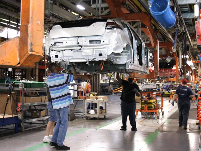 (FILES) This file photo taken on October 11, 2011 shows assembly line workers assemble Chevy Volt electric vehicles and Opel Amperas at the General Motors Detroit Hamtramck Assembly Plant in Hamtramck, Michigan. General Motors announced January 17, 2017 plans to invest about $1 billion in its US factories, following recent criticism of the company by President-elect Donald Trump. / AFP PHOTO / GETTY IMAGES NORTH AMERICA / BILL PUGLIANO