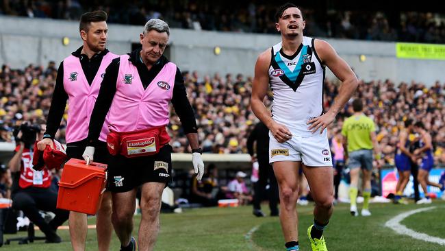 Port Adelaide’s Sam Powell-Pepper leaves the field after injuring his shoulder during the Power’s victory over West Coast in Perth on Sunday. Picture: Will Russell/AFL Media/Getty Images