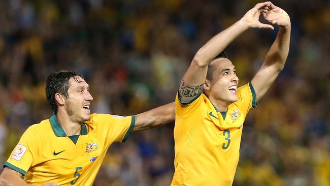 NEWCASTLE, AUSTRALIA - JANUARY 27: Jason Davidson and Mark Milligan of Australia celebrate a goal during the Asian Cup Semi Final match between the Australian Socceroos and the United Arab Emirates at Hunter Stadium on January 27, 2015 in Newcastle, Australia. (Photo by Tony Feder/Getty Images) *** BESTPIX ***