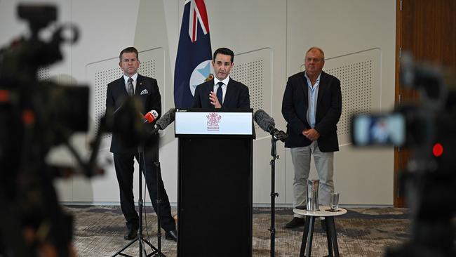 Premier David Crisafulli with deputy Jarrod Bleijie and new member for Capalaba Russell Field, with only the Queensland flag behind them. Picture: Lyndon Mechielsen/Courier Mail