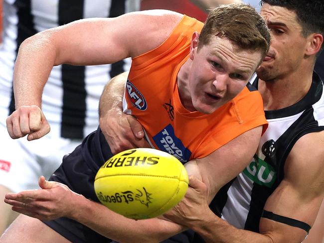 Giants Tom Green tackled by Collingwood's Scott Pendlebury during AFL match between the GWS Giants and Collingwood at Giants Stadium. Picture. Phil Hillyard